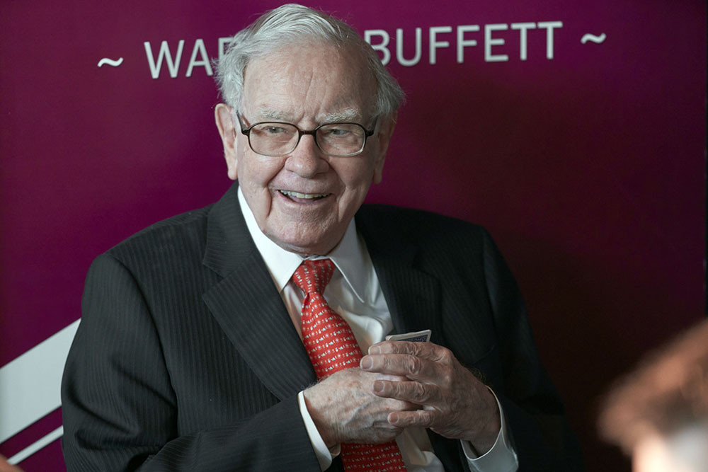 Warren Buffett's firm reports $12.8bn loss as investments fall but its insurers performed well